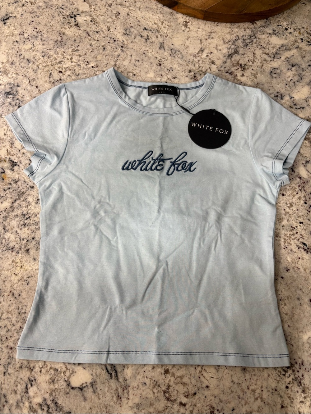White Fox Boutique Light Blue Script Logo Short Sleeve Baby Tee